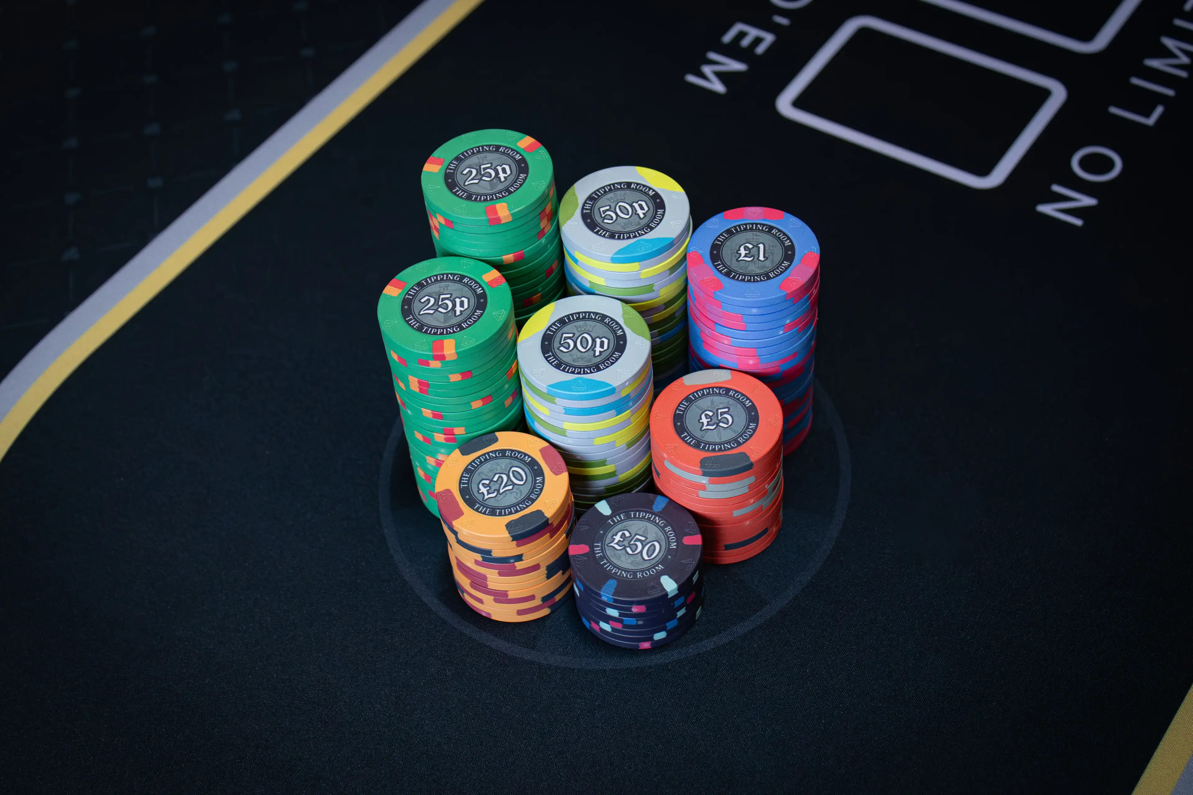 Selection of The Tipping Room custom ceramic poker chips showing medieval greyscale artwork across denominations