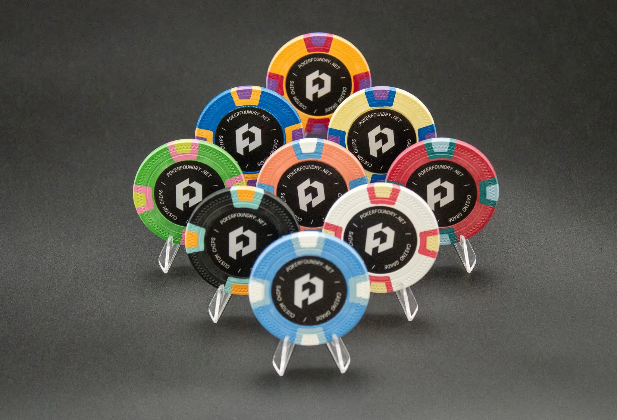 Clay composite chips with full-colour inlay print showing sharp typography and rich centre graphics