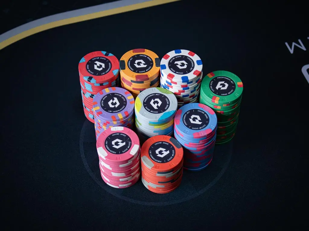 Stack of 10g custom ceramic poker chips with full-colour direct-to-chip UV printing and flat edges