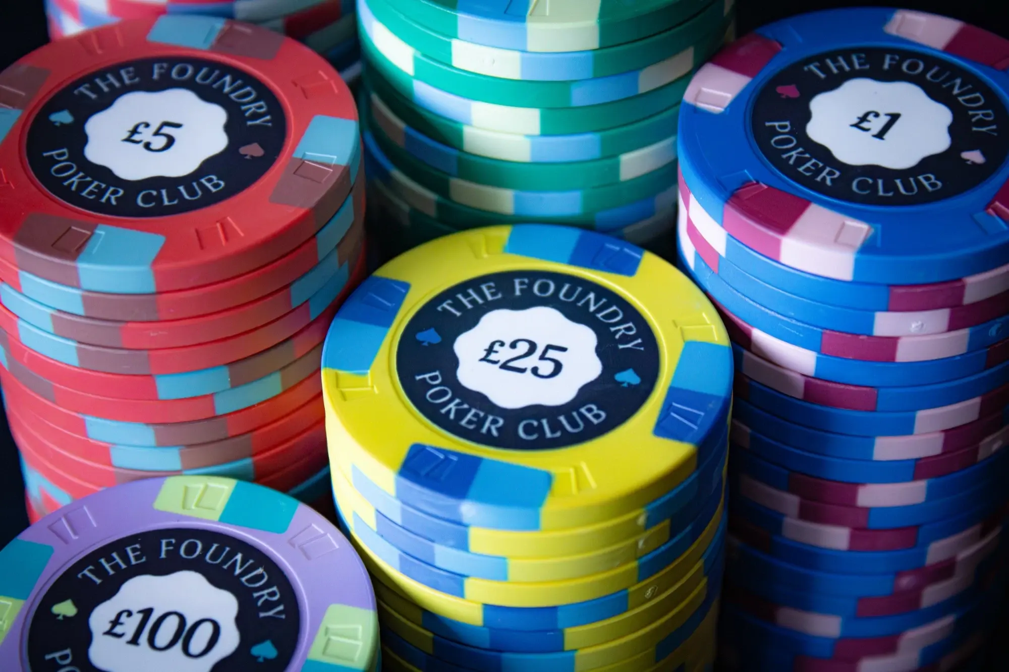 Close-up of The Foundry Poker Club ceramic chip stacks